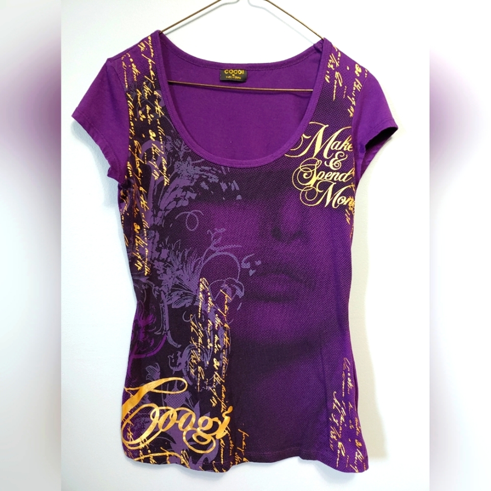 Vintage COOGI Tee size Med. gold on Purple.